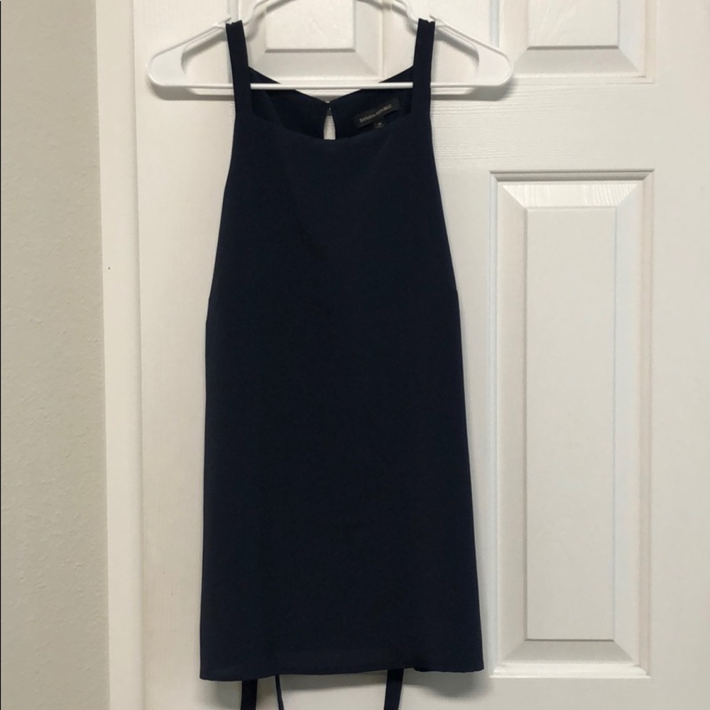 Navy blue tank with back tie. Double lined. NWT
